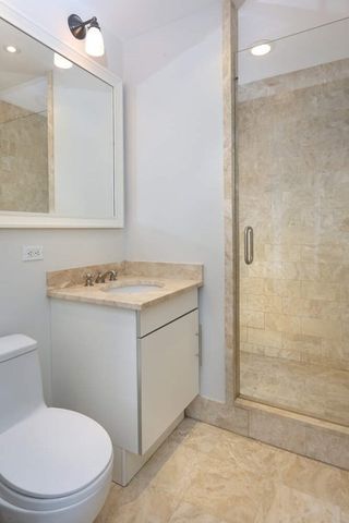 a bedroom with a bed and a mirror