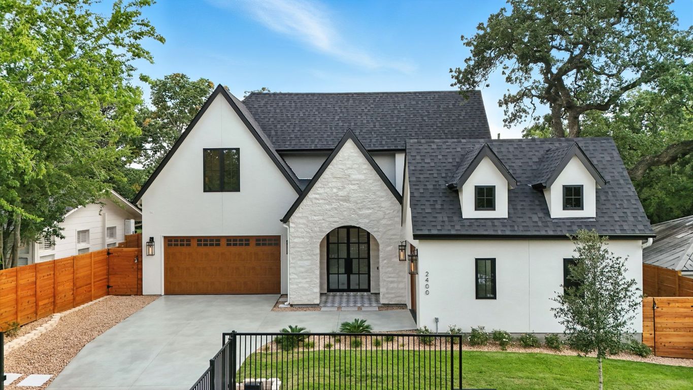 a front view of a house with garden