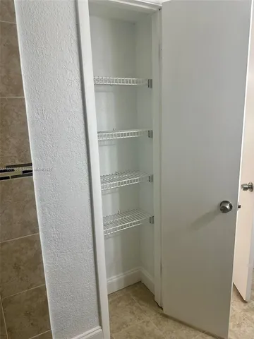 a view of empty room with windows