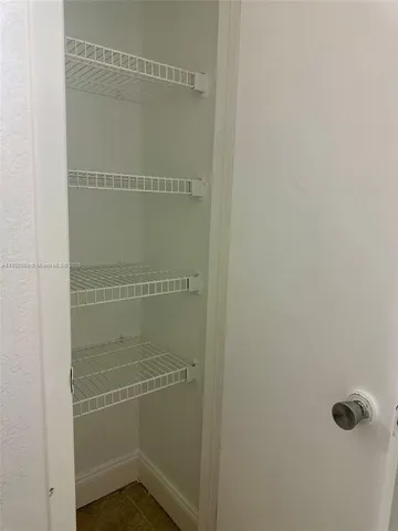 a view of a glass door and a living room