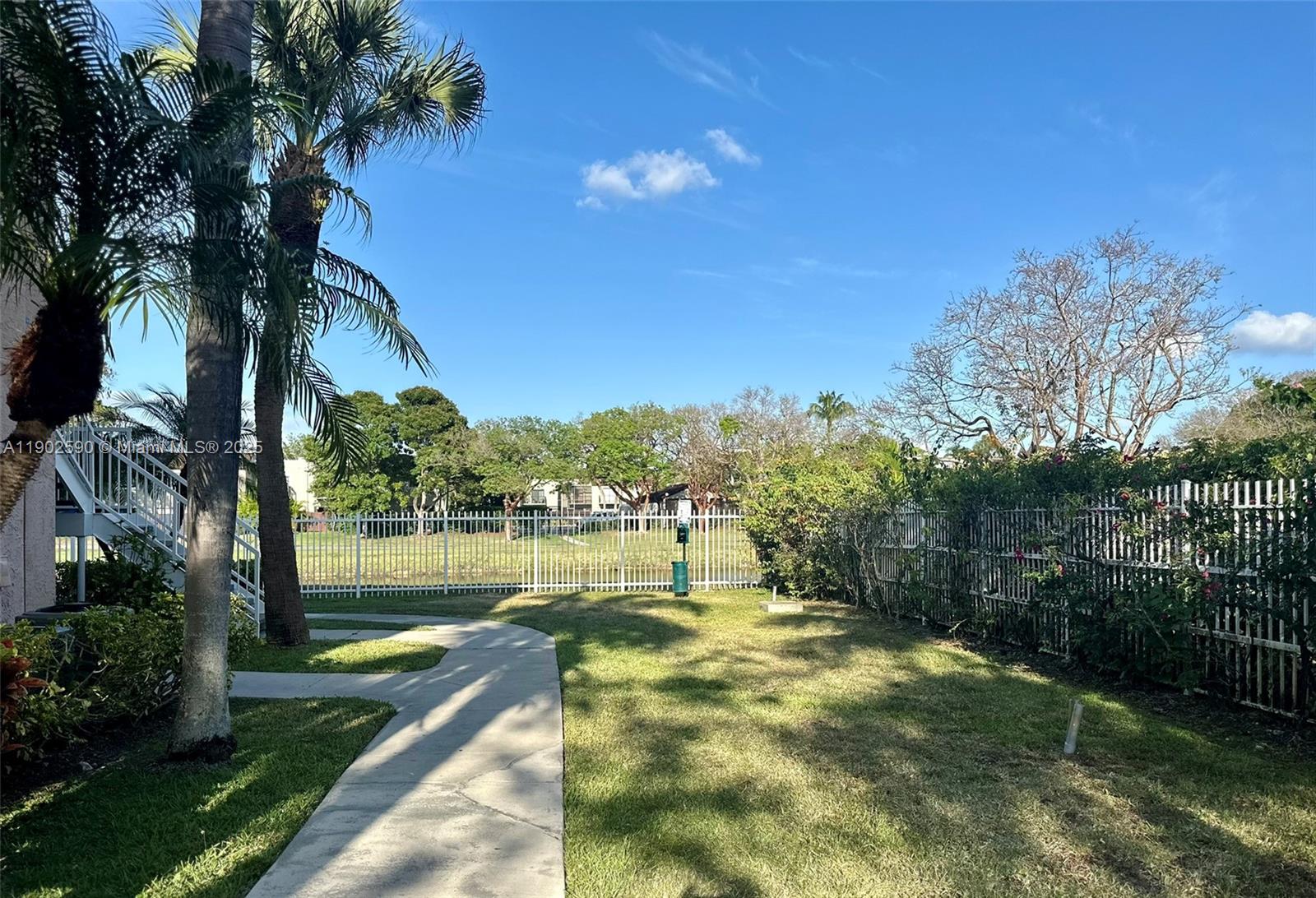 10581 Southwest 155th Court, Unit 1214 Miami, FL 33196 - Photo 28 of 35 a view of a lake with a big yard