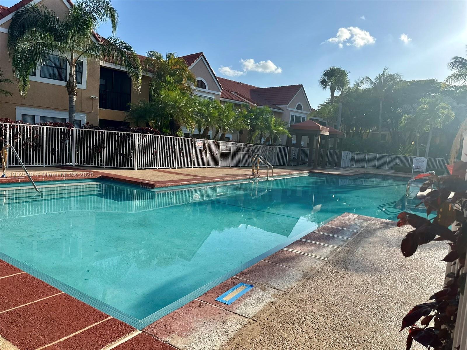 10581 Southwest 155th Court, Unit 1214 Miami, FL 33196 - Photo 33 of 35 a view of a balcony with a yard