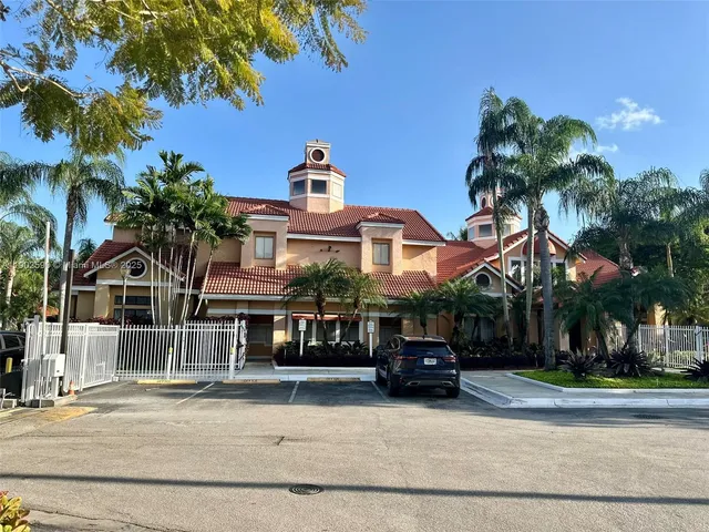 a front view of a house with a garden and a yard