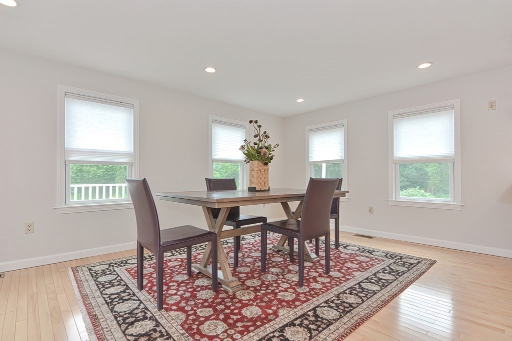 3 Zina Road Hudson, MA 01749 - Photo 15 of 41 a view of a dining room with furniture window and wooden floor
