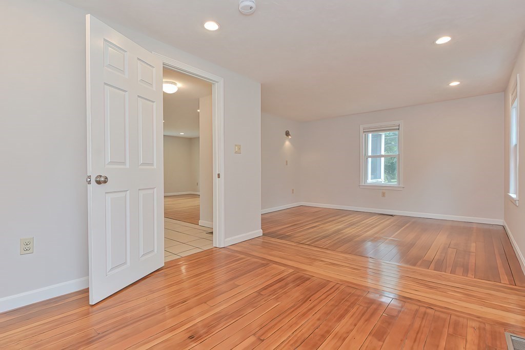 3 Zina Road Hudson, MA 01749 - Photo 16 of 41 a view of empty room with wooden floor and fan