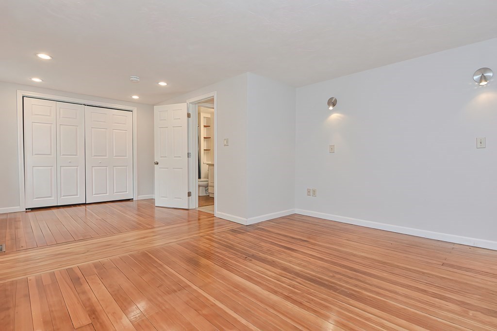 3 Zina Road Hudson, MA 01749 - Photo 17 of 41 a view of an empty room with wooden floor and a window
