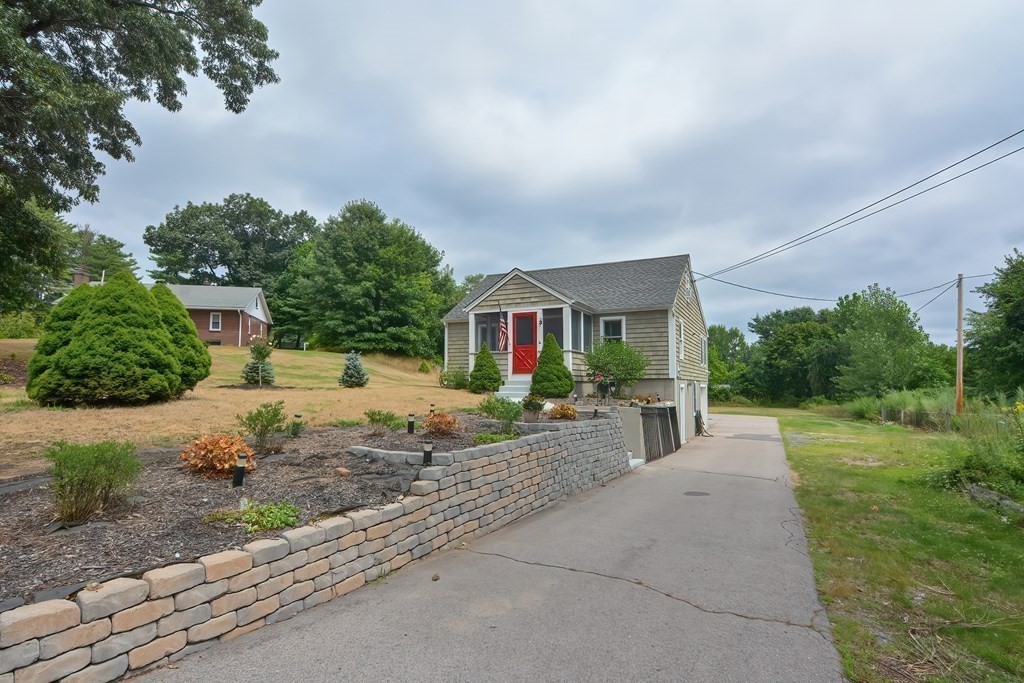 3 Zina Road Hudson, MA 01749 - Photo 2 of 41 a front view of a house with garden