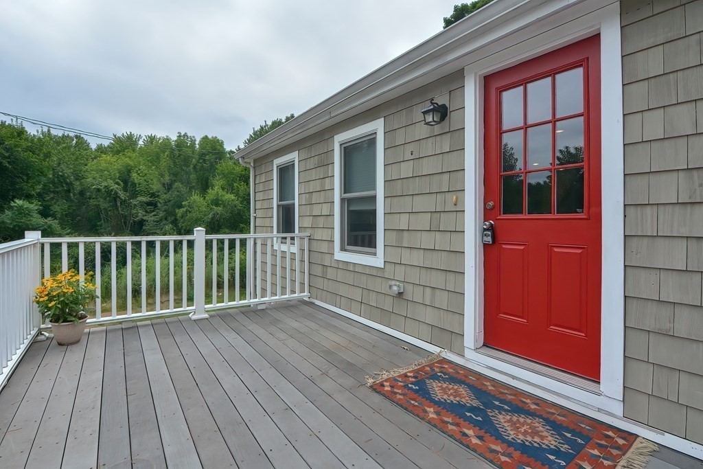 3 Zina Road Hudson, MA 01749 - Photo 28 of 41 a view of backyard with a deck and wooden floor