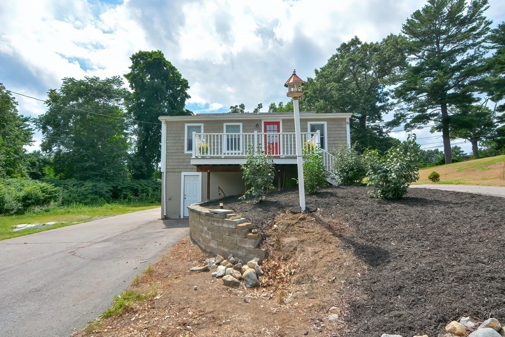 3 Zina Road Hudson, MA 01749 - Photo 33 of 41 a view of a house with a yard and hanging chair