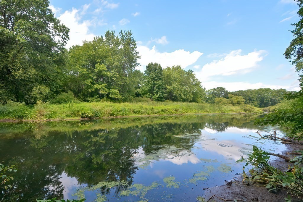 3 Zina Road Hudson, MA 01749 - Photo 36 of 41 a view of a lake with a yard
