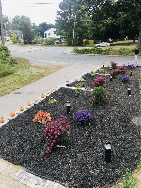 3 Zina Road Hudson, MA 01749 - Photo 38 of 41 a view of a lake with a yard and car parked