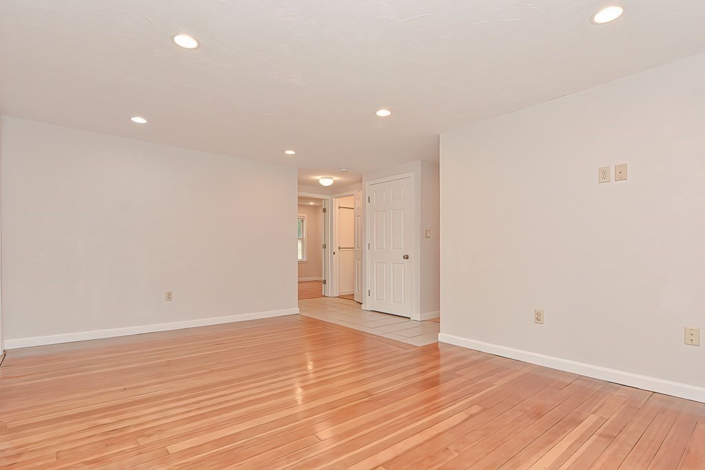 3 Zina Road Hudson, MA 01749 - Photo 6 of 41 a view of an empty room with wooden floor