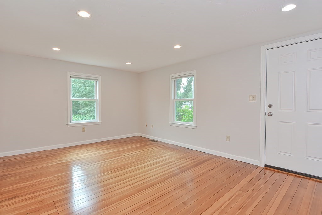 3 Zina Road Hudson, MA 01749 - Photo 8 of 41 an empty room with wooden floor and windows
