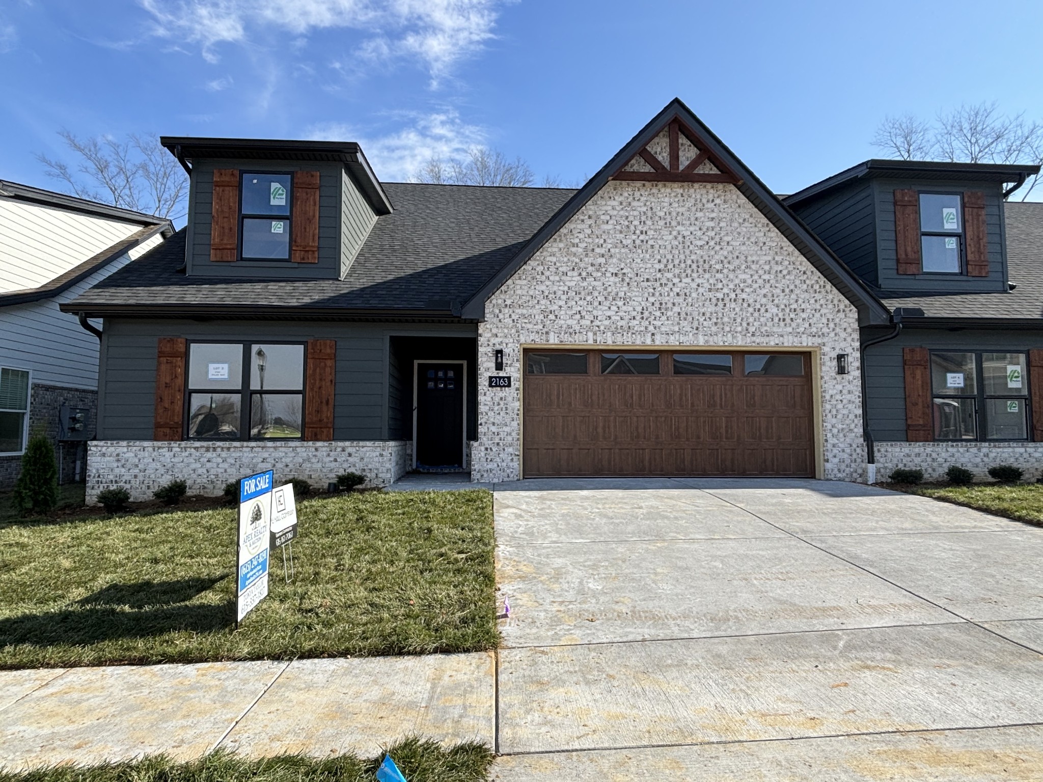 2163 Rylee Way Greenbrier, TN 37073 - Photo 1 of 7 a front view of a house with a yard