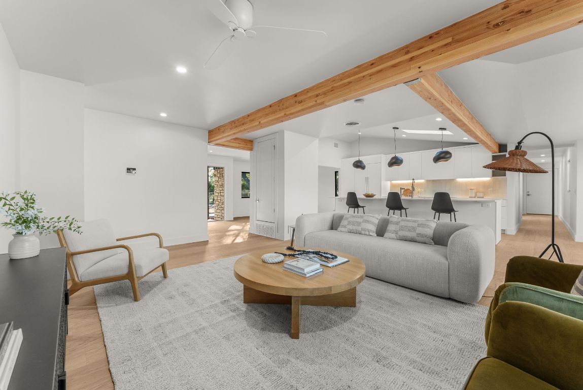 8717 South View Road Austin, TX 78737 - Photo 11 of 38 a living room with furniture and a large mirror