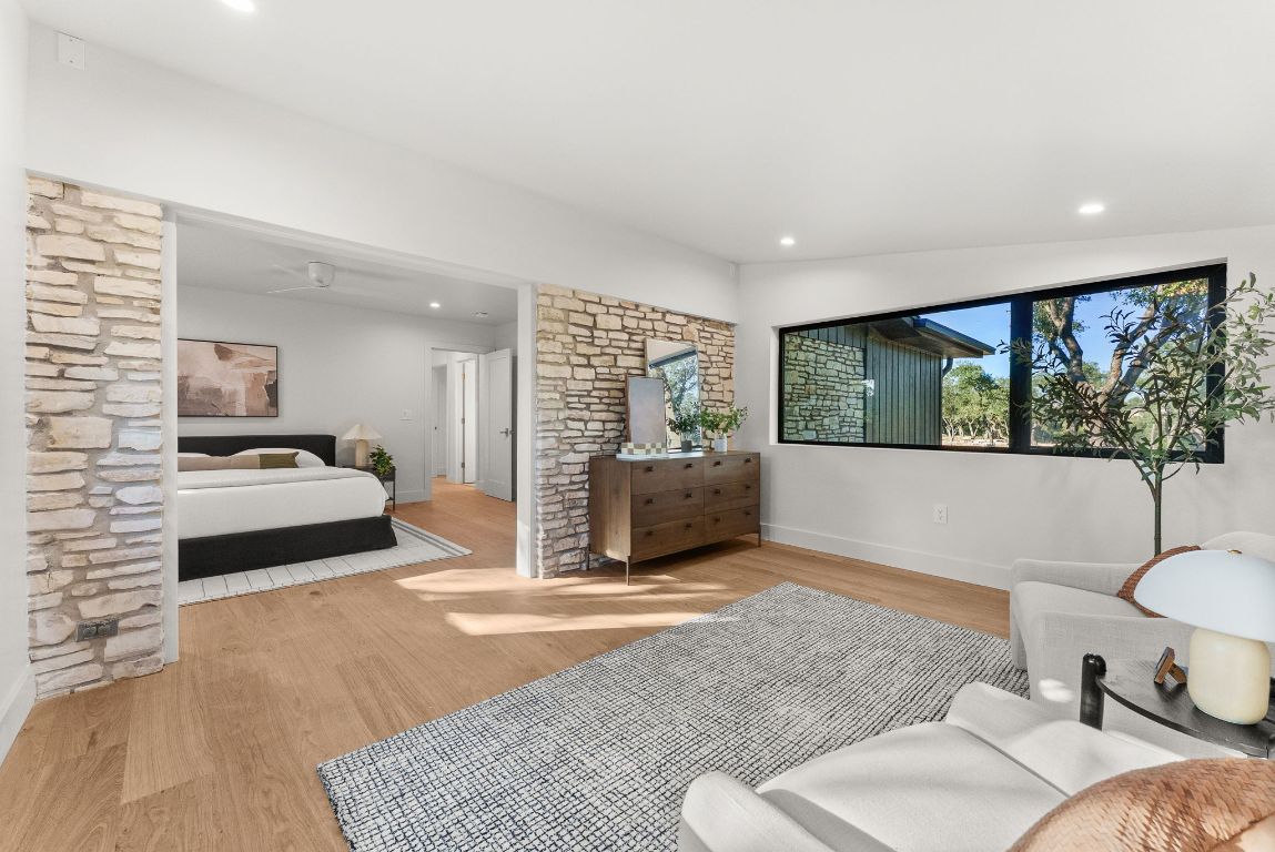 8717 South View Road Austin, TX 78737 - Photo 14 of 38 a living room with furniture and a large window