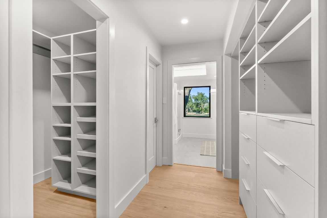 8717 South View Road Austin, TX 78737 - Photo 16 of 38 a view of an empty walk in closet