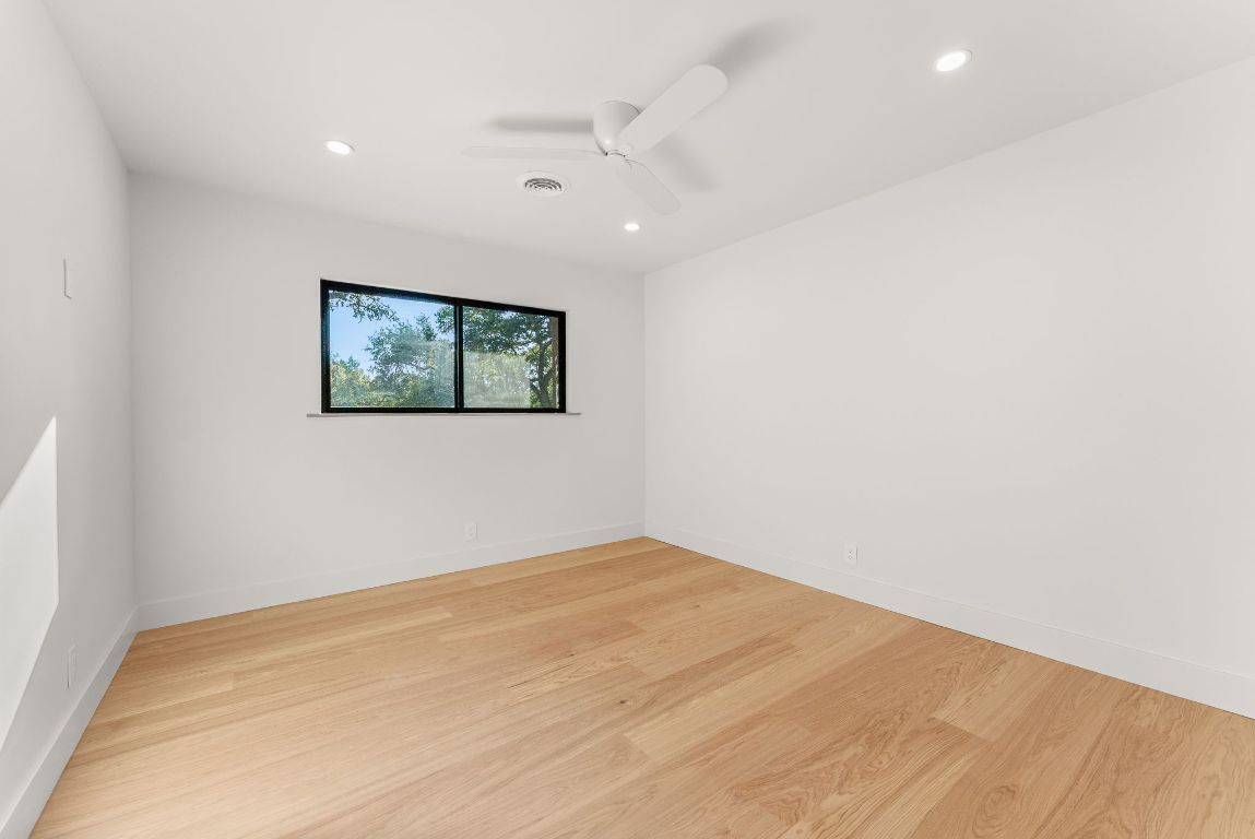 8717 South View Road Austin, TX 78737 - Photo 22 of 38 an empty room with a window