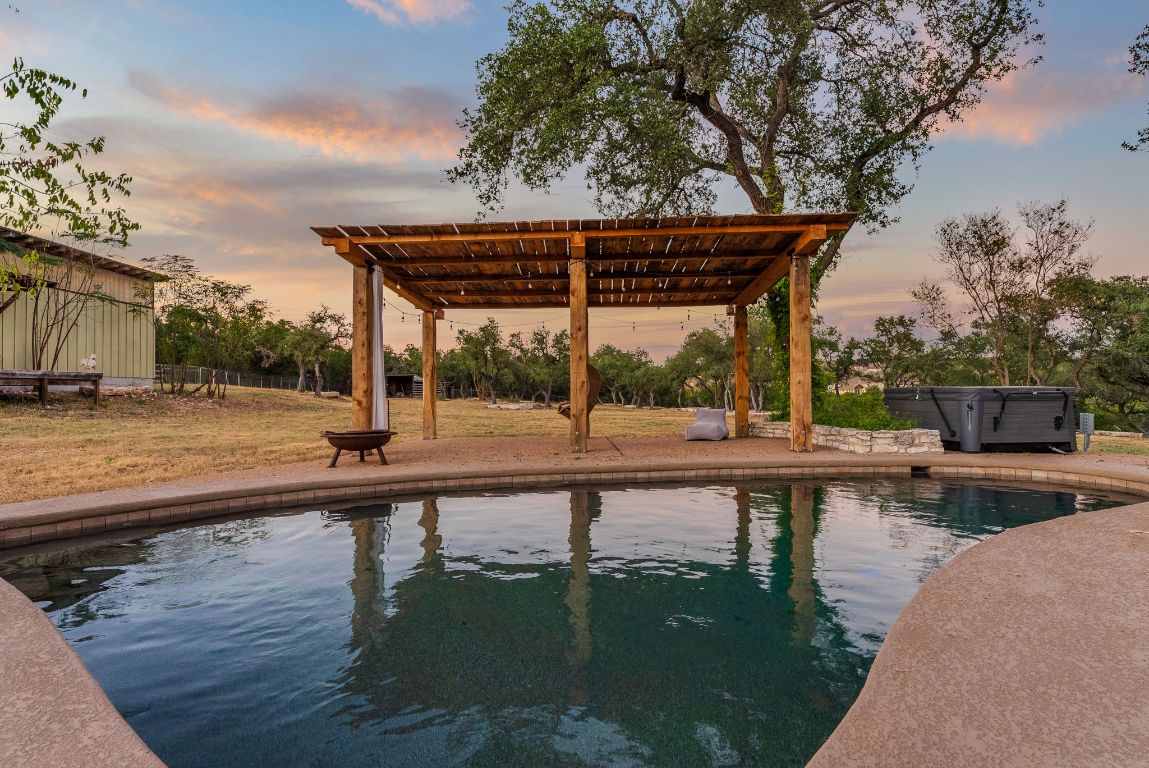 8717 South View Road Austin, TX 78737 - Photo 28 of 38 a view of a swimming pool with a patio