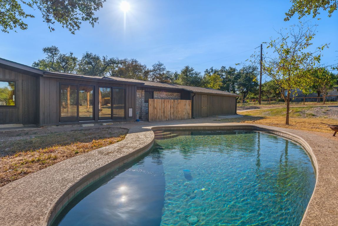 8717 South View Road Austin, TX 78737 - Photo 30 of 38 a view of a swimming pool with a patio