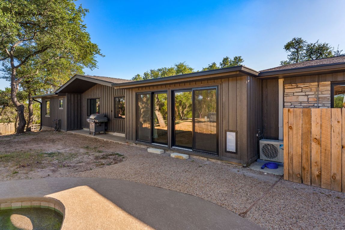 8717 South View Road Austin, TX 78737 - Photo 32 of 38 a view of a house with a porch