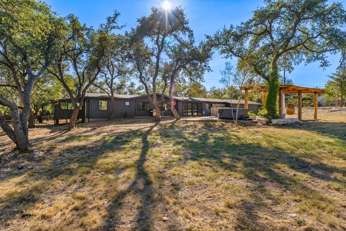 8717 South View Road Austin, TX 78737 - Photo 36 of 38 a view of a yard with a tree