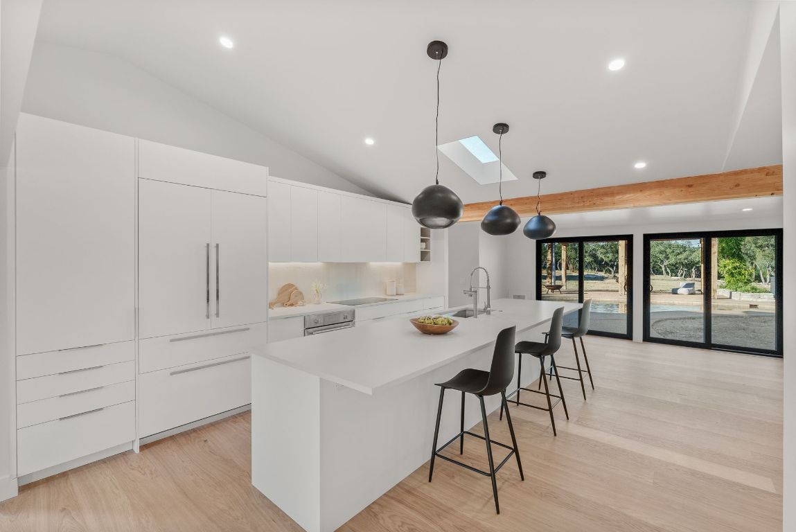 8717 South View Road Austin, TX 78737 - Photo 6 of 38 a view of a kitchen with furniture and a large window