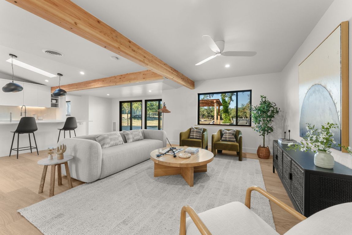 8717 South View Road Austin, TX 78737 - Photo 9 of 38 a living room with furniture and a large window