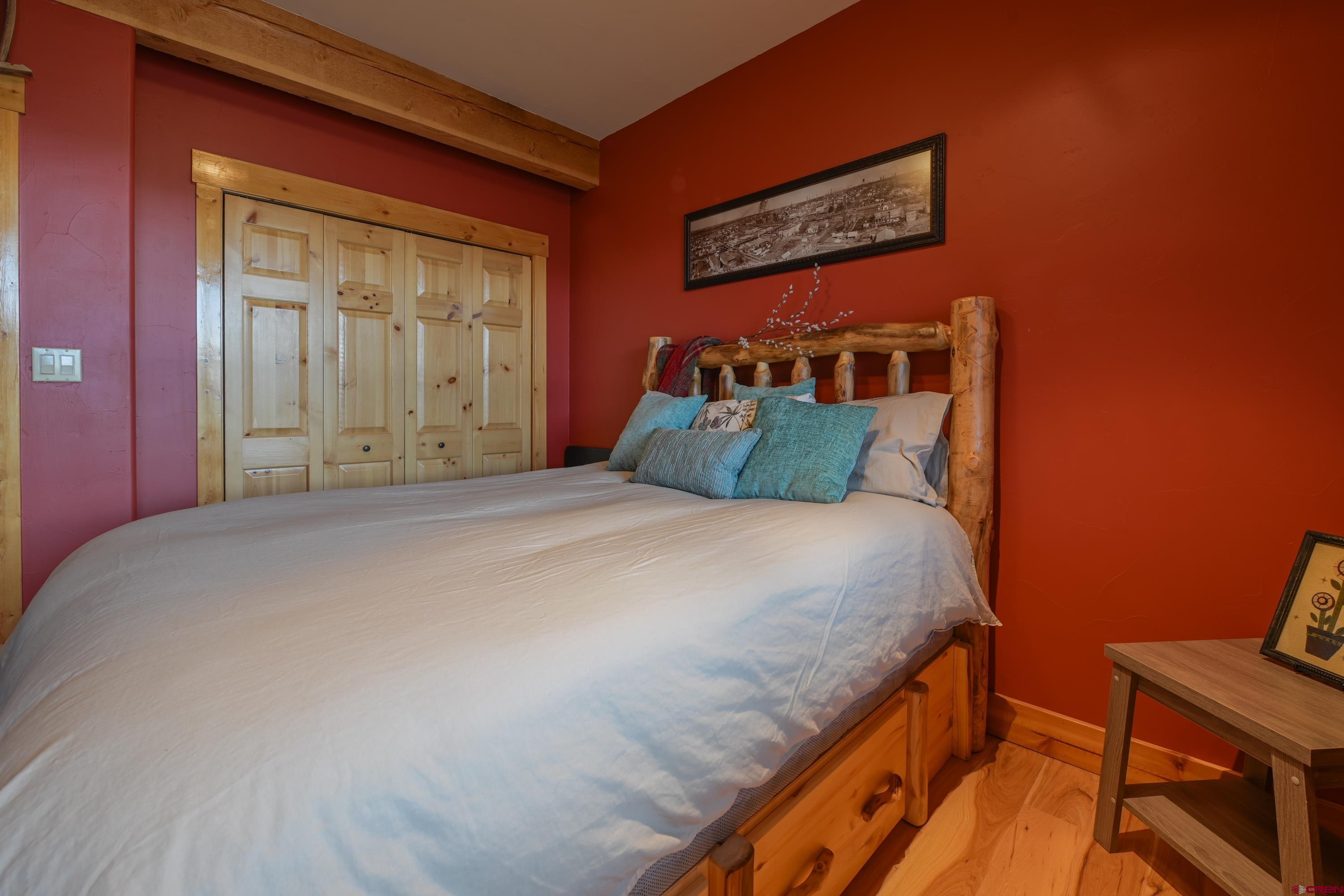 32 St Andrew's Circle Crested Butte, CO 81224 - Photo 27 of 35 a bedroom with a bed and a window
