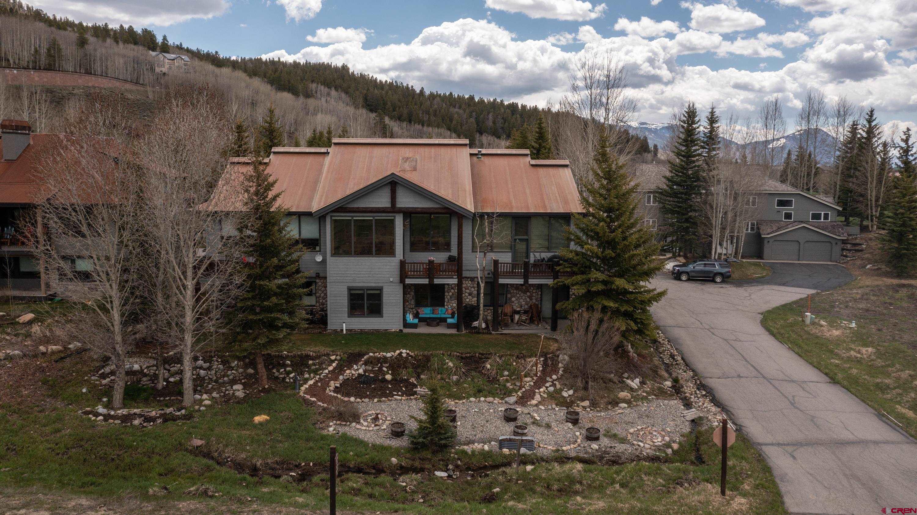 32 St Andrew's Circle Crested Butte, CO 81224 - Photo 3 of 35 a view of a house with a patio