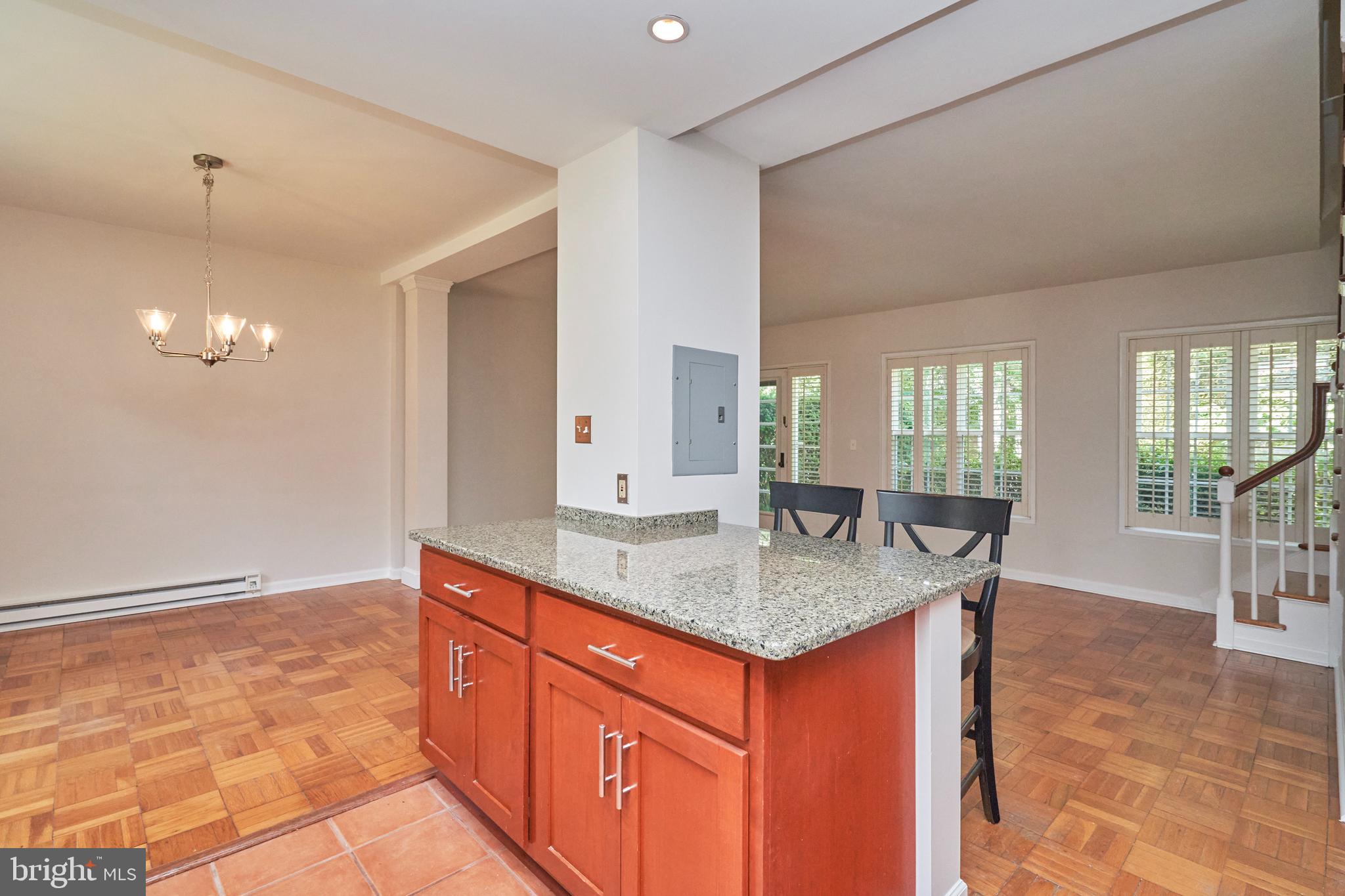 3314 Gunston Road, Unit 7303314 Alexandria, VA 22302 - Photo 10 of 42 Open main level with eat-in bar area