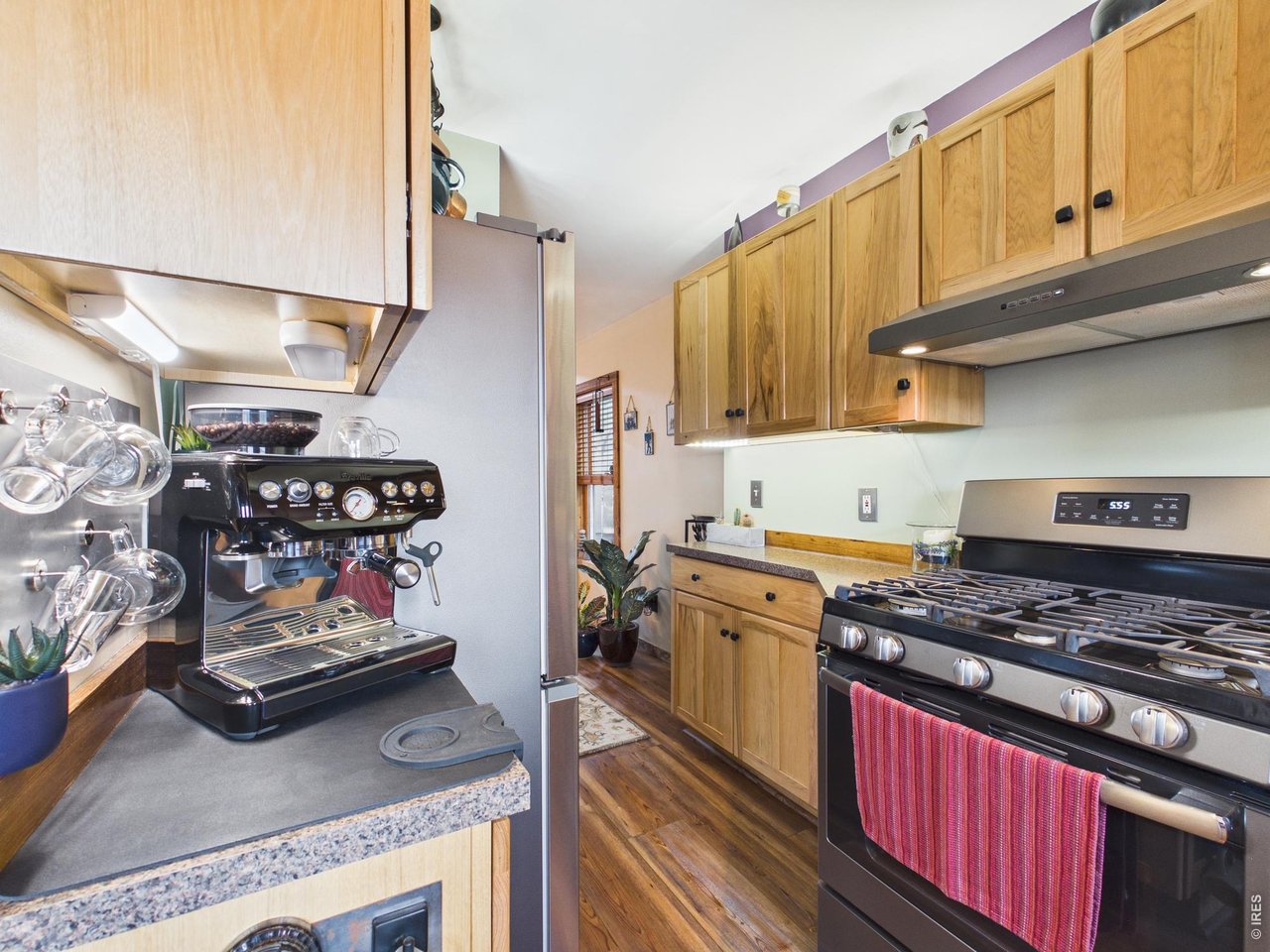 131 West Boulder Street Nederland, CO 80466 - Photo 43 of 46 Custom cabinetry, gas burner stove, hood, rustic charm, open floorplan.