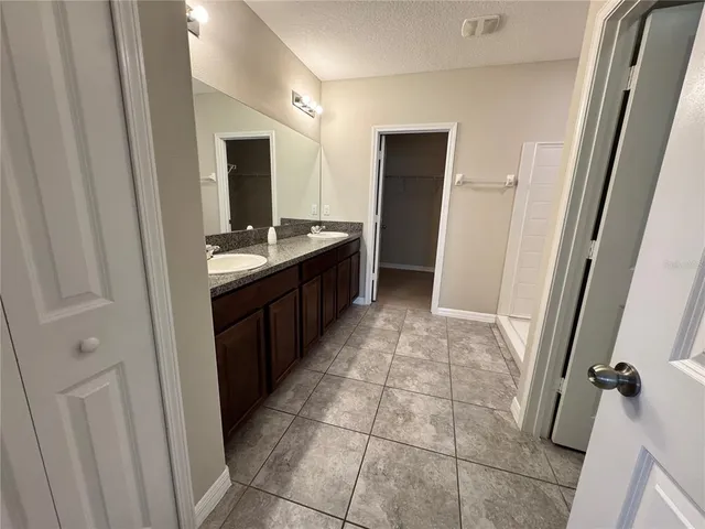 a kitchen with a sink and a refrigerator
