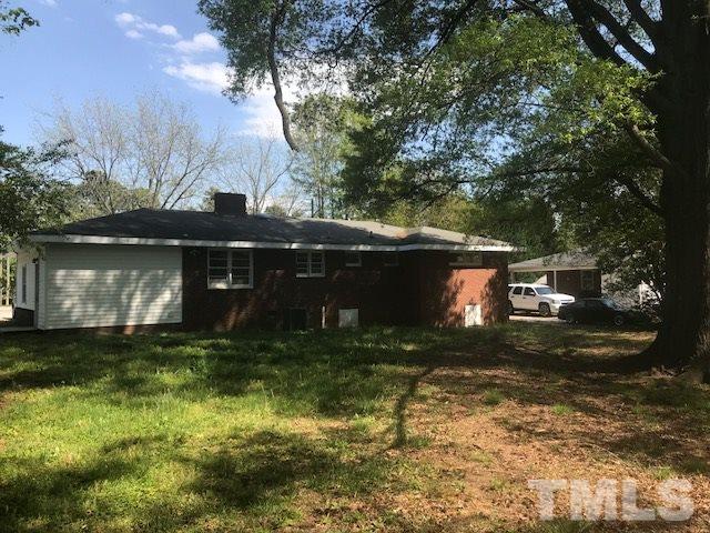 2901 North New Hope Road Raleigh, NC 27604 - Photo 2 of 13 a view of a yard in front of a house with large trees