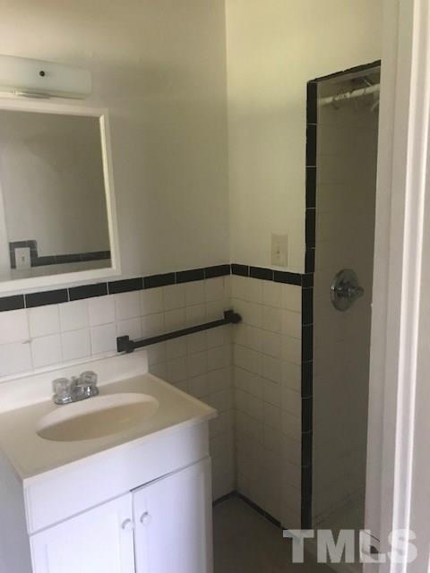 2901 North New Hope Road Raleigh, NC 27604 - Photo 11 of 13 a bathroom with a sink and a mirror