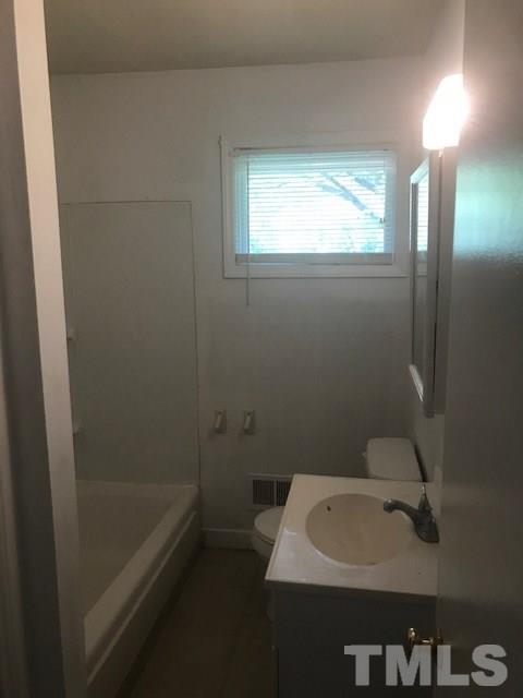 2901 North New Hope Road Raleigh, NC 27604 - Photo 12 of 13 a bathroom with a sink and a bathtub