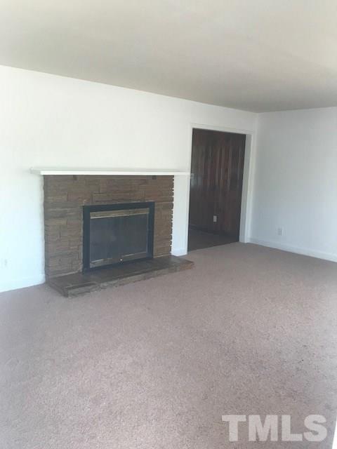 2901 North New Hope Road Raleigh, NC 27604 - Photo 13 of 13 a view of an empty room with a fireplace and cabinet