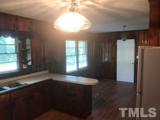 2901 North New Hope Road Raleigh, NC 27604 - Photo 6 of 13 a kitchen with a fridge and a sink