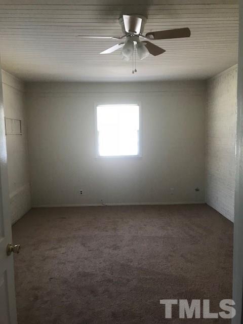 2901 North New Hope Road Raleigh, NC 27604 - Photo 8 of 13 an empty room with a window and a fan