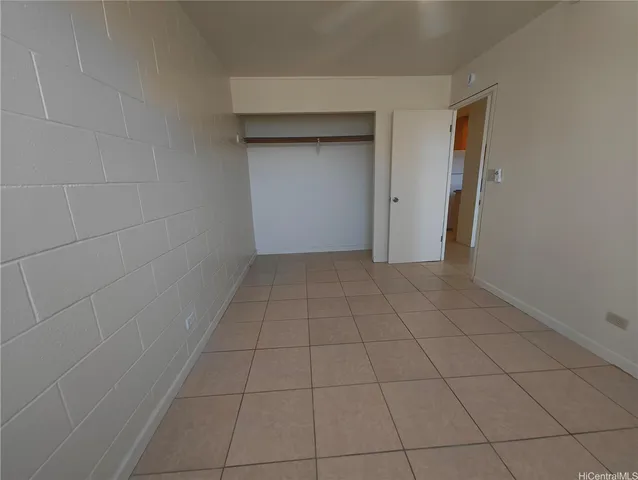 a view of a livingroom with an empty space and a window