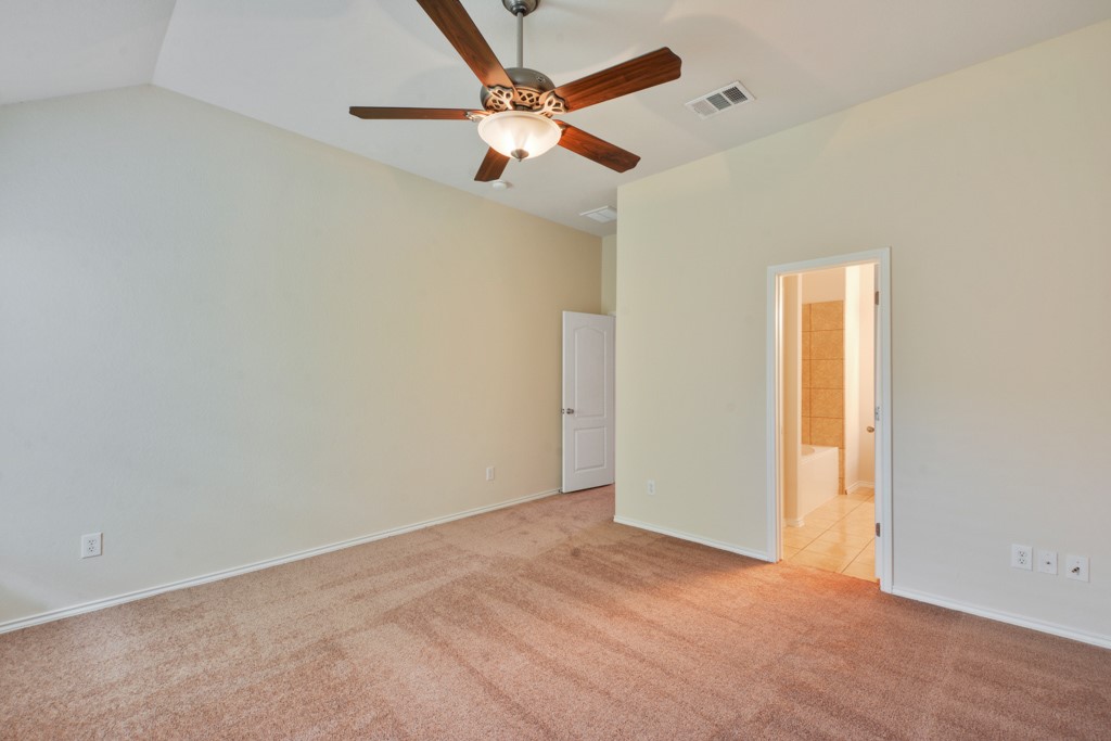 291 Cold Spring Buda, TX 78610 - Photo 13 of 25 an empty room with a window and a fan