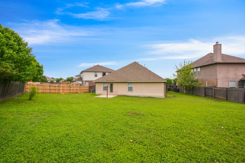 291 Cold Spring Buda, TX 78610 - Photo 25 of 25 a view of a house with a yard