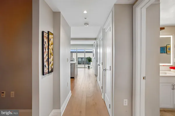 a open kitchen with stainless steel appliances kitchen island granite countertop a refrigerator and cabinets