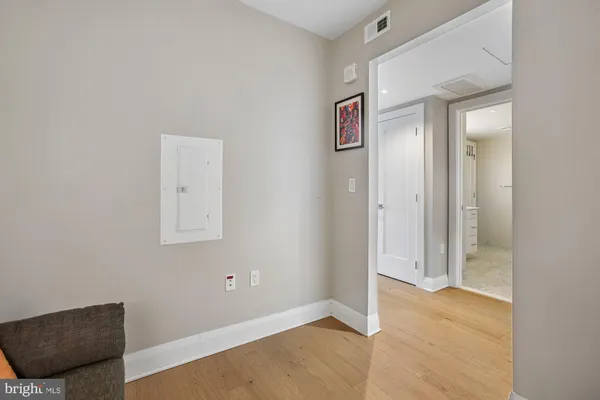 a view of a patio with couches chairs and floor to ceiling window