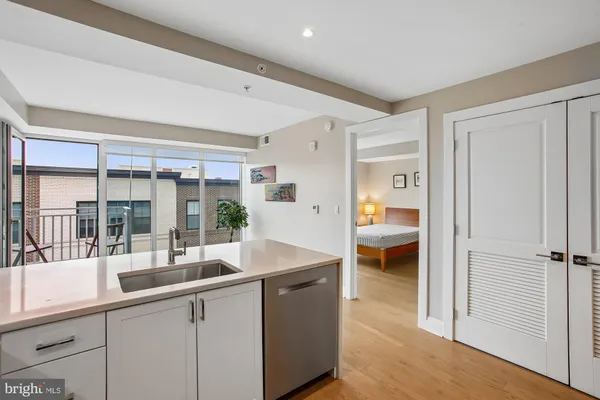 a blue bed sitting in a bedroom next to a lamp