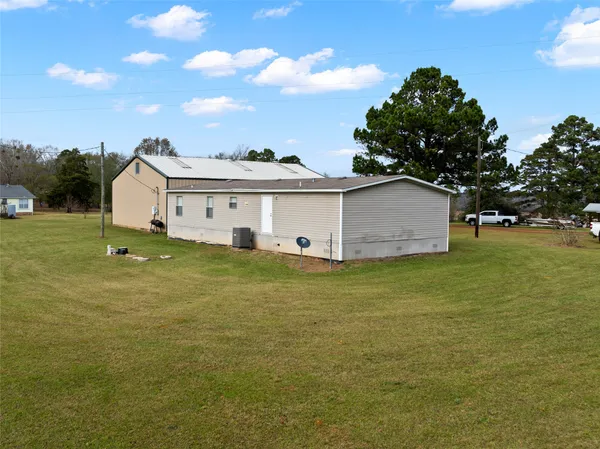 a view of a house with a big yard