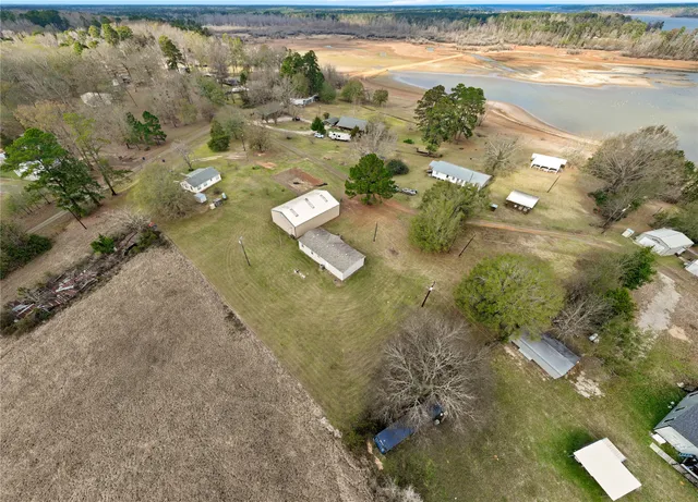 a view of an house with backyard space and balcony