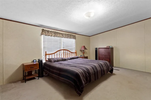 a bathroom with a granite countertop sink toilet a shower and a mirror
