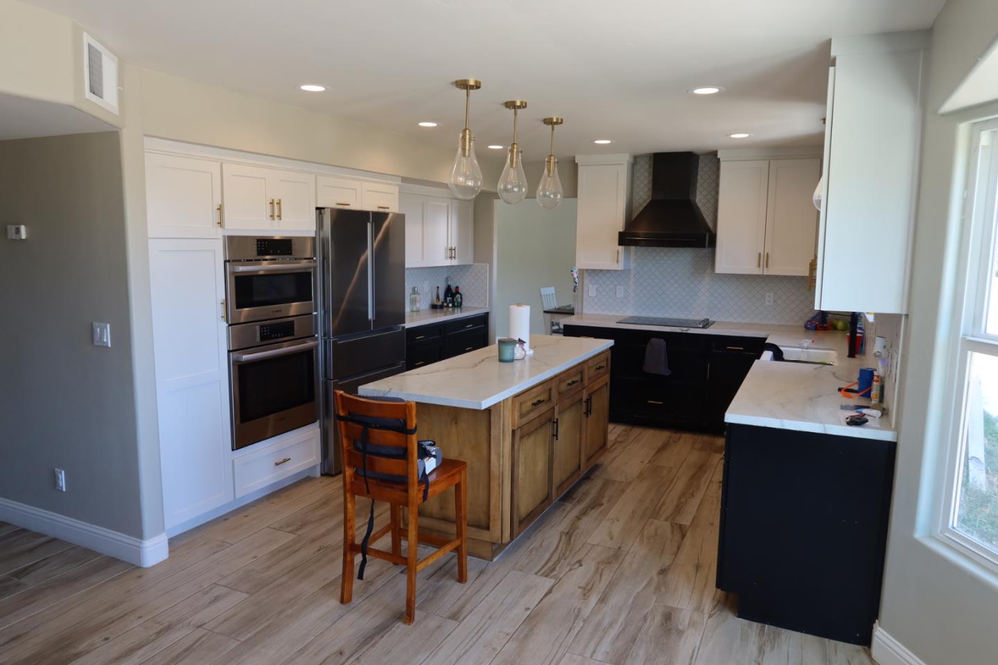 50950 Pine Canyon Road King City, CA 93930 - Photo 4 of 23 a kitchen with a stove a refrigerator and a microwave