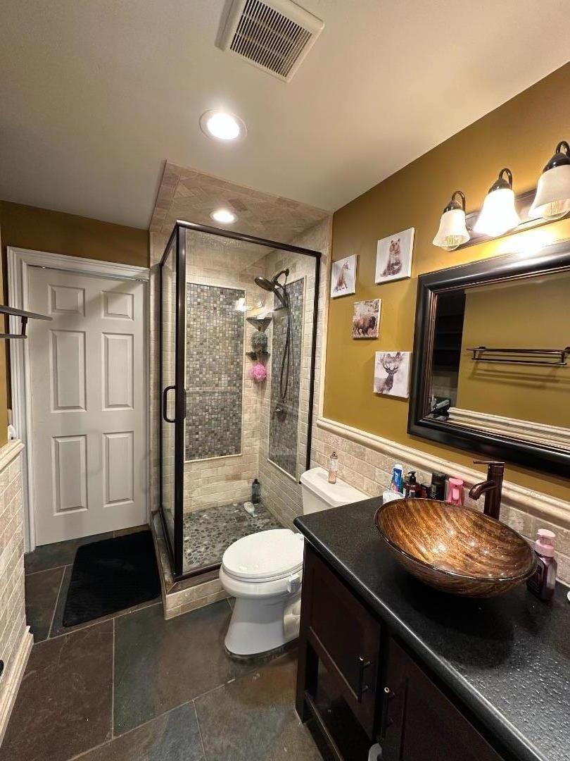 50950 Pine Canyon Road King City, CA 93930 - Photo 5 of 23 a bathroom with a sink a toilet a mirror and shower